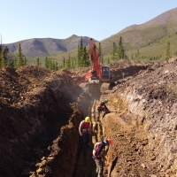 Excavator trenching at the Rusk