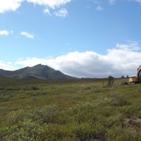 Excavator on hillside